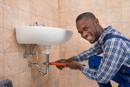 PlombGH plumber repairing a bathroom sink