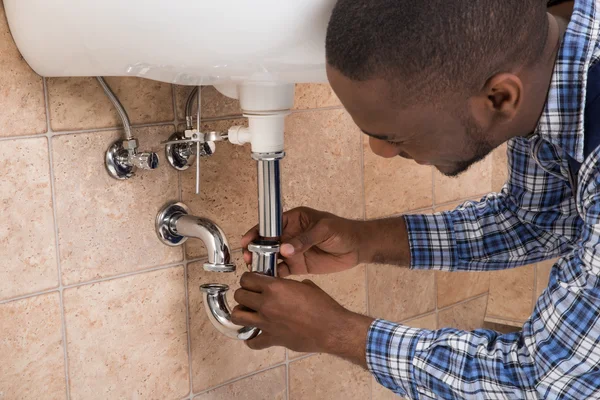 PlombGH plumber installing a water meter